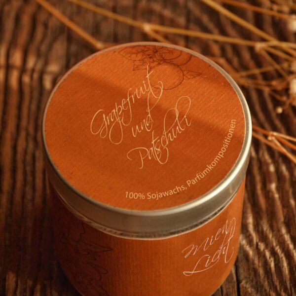 Soy wax candle with the scent of “grapefruit and patchouli”
